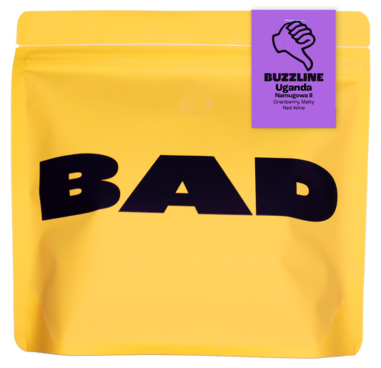 Yellow coffee bag with 'BAD' text and a purple label on a white background
