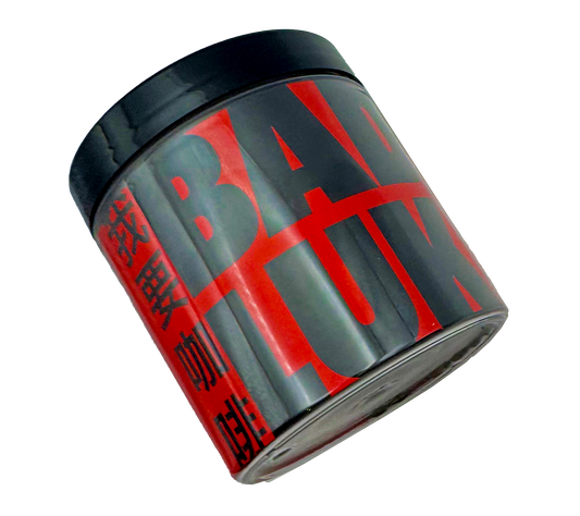 A container of Bad Luk coffee beans with red and black labeling on a transparent background.