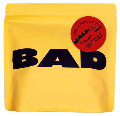 Yellow package with 'BAD' text and a red label describing the contents, half caff specialty coffee