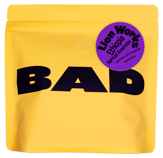 Yellow coffee bag with 'BAD' text and a purple label which reads "Lion Works Ethiopia Natural Anaerobic Fermentation" 